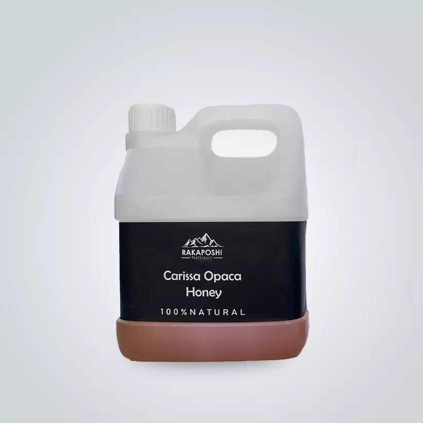 Golden Carissa Opaca raw honey in plastic jar - 1000g