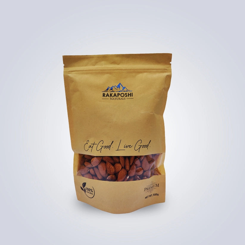 Premium almonds in a 500g kraft pouch showing natural brown almonds from Gilgit-Baltistan