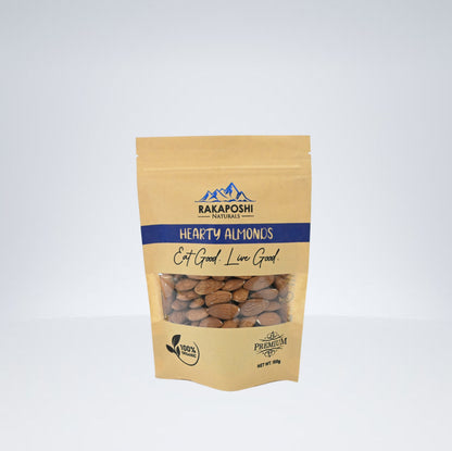 Premium almonds in clear kraft pouch showing natural brown almonds from Gilgit-Baltistan