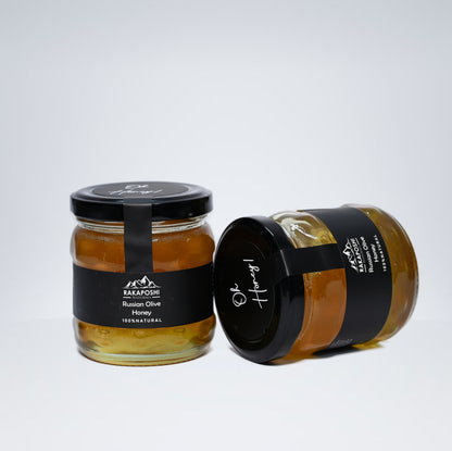 Amber Russian Olive raw honey in glass jar