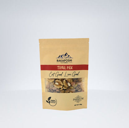 A package of Rakaposhi Naturals Premium Trail Mix with visible apricot kernels, brainy walnuts, sweet raisins, and white mulberries.